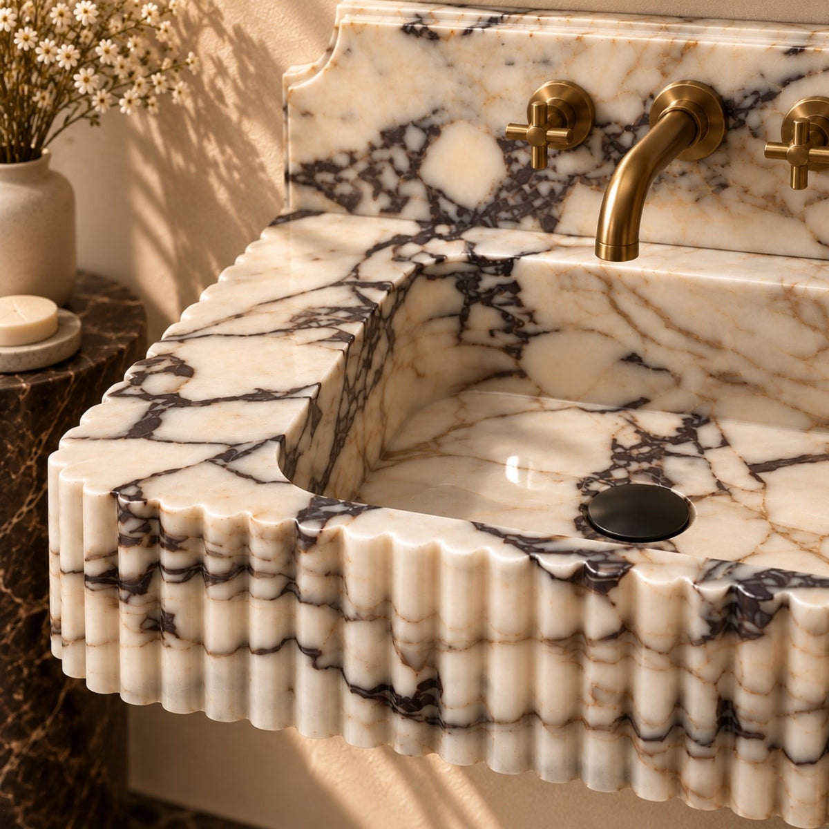 Luxury powder room with a floating marble sink and brushed brass fixtures