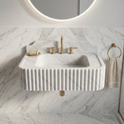 Carrara White marble basin with a wide top ledge, deep bowl, and decorative ribbing wrapping around the front and side edges.